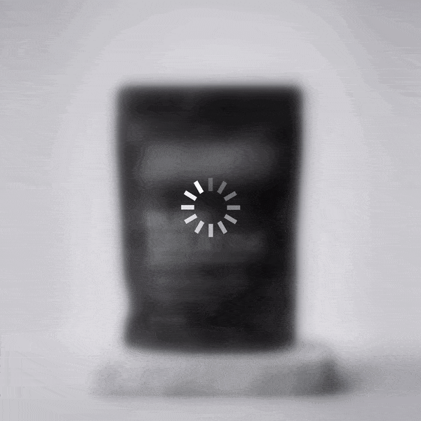 A blurred product on a plinth with a loading spinner. Text: Something is coming soon.